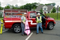 Firemen outside of a truck